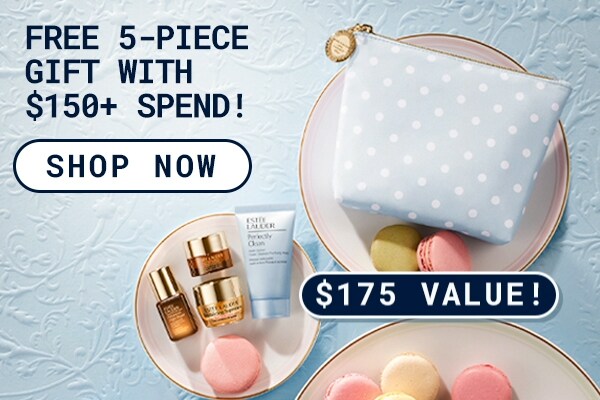 Photograph of the FREE 5 - Piece Gift with any purchase over $150. Product flatlay on plates with macarons.